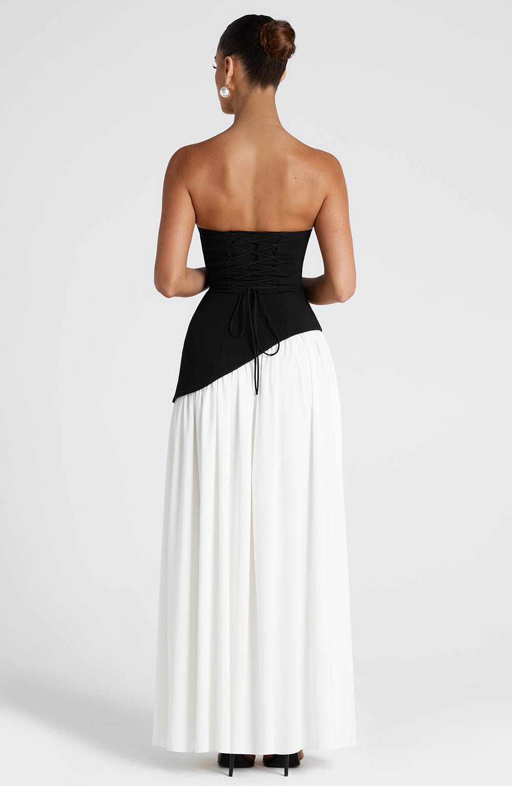 Black and White Chic Slit Maxi Dress – Modern strapless formal dress with high slit, perfect for weddings and black-tie events - back side