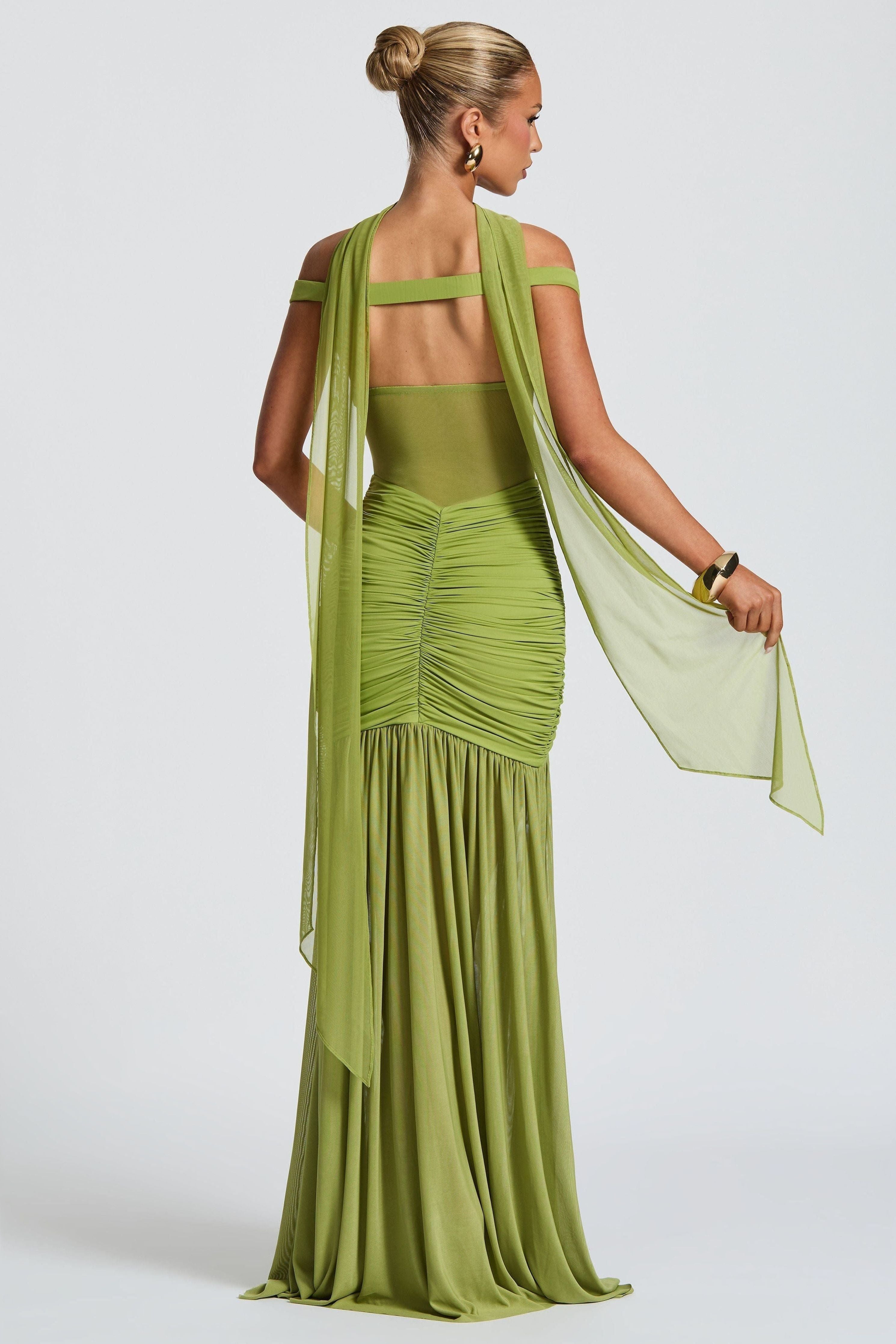 Back view of green off-shoulder maxi gown with floor-length skirt – Isadora London