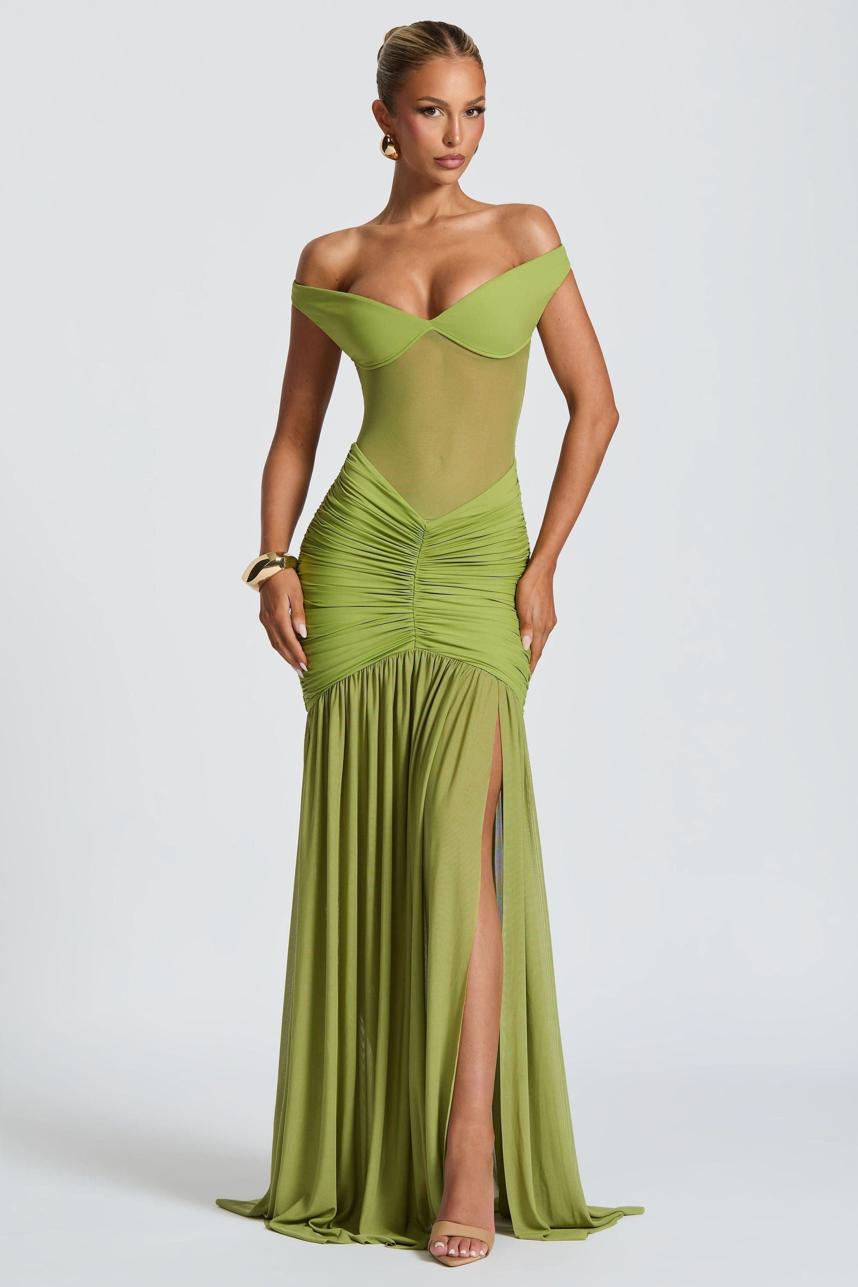 Model wearing Elegant Occasion Maxi Dress in green with off-shoulder neckline – Isadora London