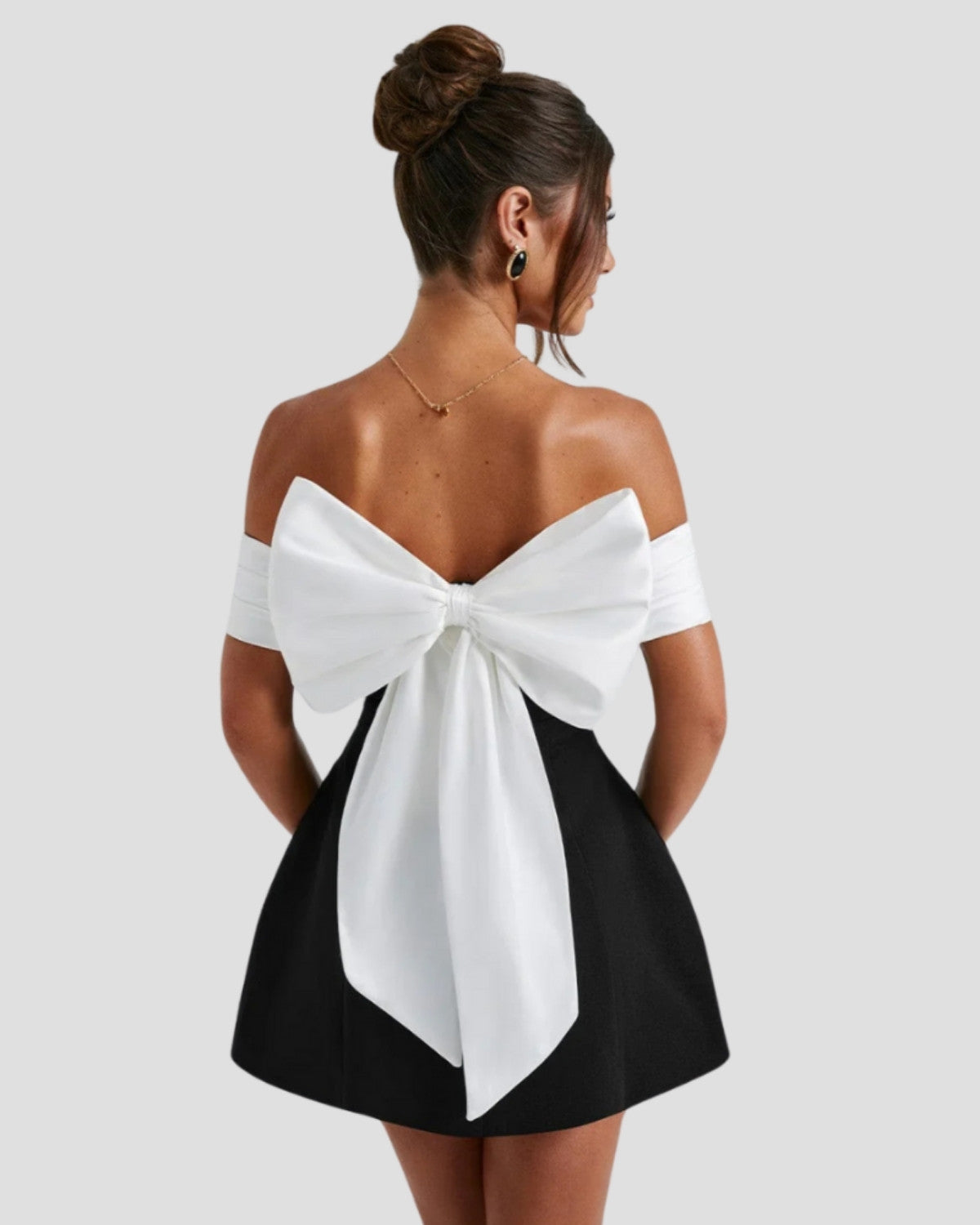 Elegant Bow-Back Mini Dress by Isadora London – back view with oversized white bow detail.
