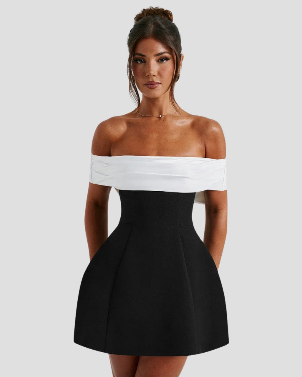 Elegant Bow-Back Mini Dress by Isadora London – black & white off-shoulder mini dress, front view.