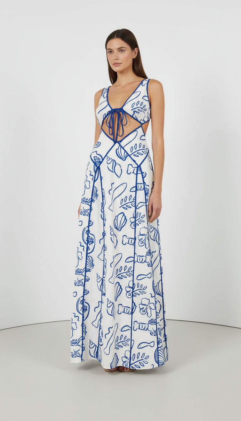 Close-up of Ophelia Maxi Dress fabric – white base with blue marine-inspired print and contrast binding from Isadora London.