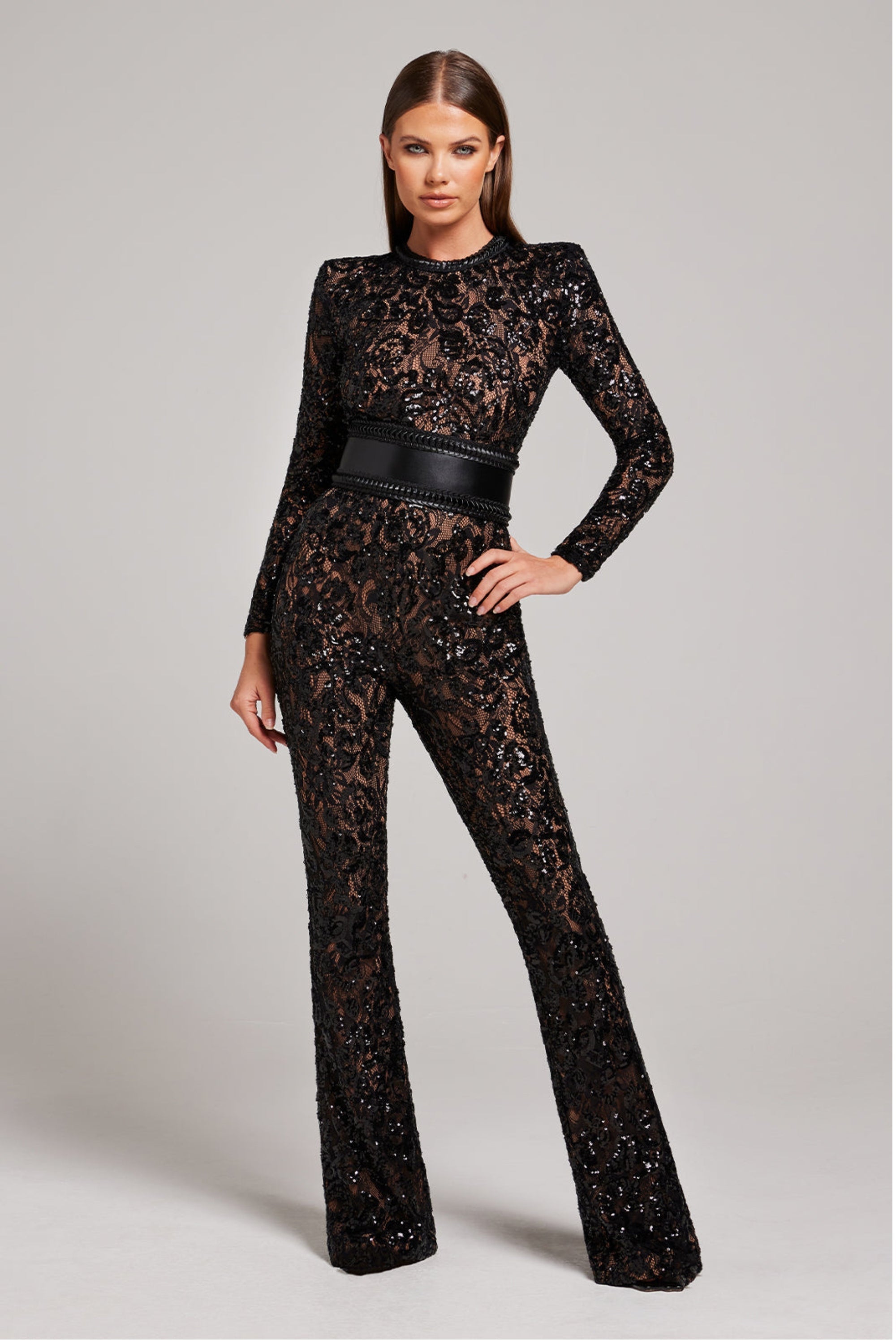 Model wearing the black floral lace tailored jumpsuit, full front view with fitted silhouette.