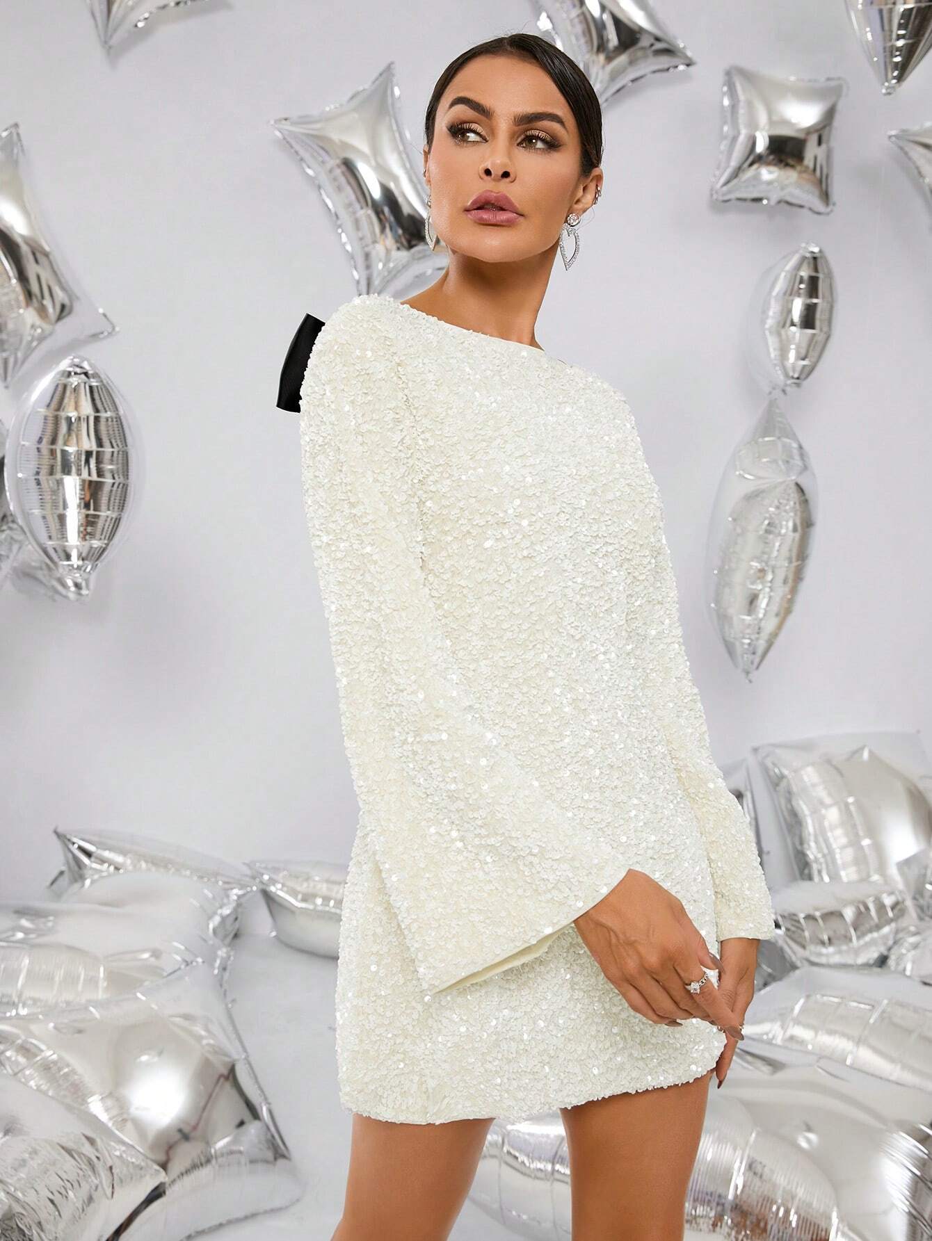 Ivory glitter mini ¾ view – A-line shift, long sleeves; photo-ready party look – Isadora London.