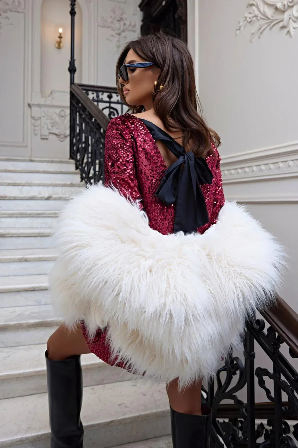 Red glitter mini seated styling – long sleeves, mini length, high-shine sparkle – Isadora London.