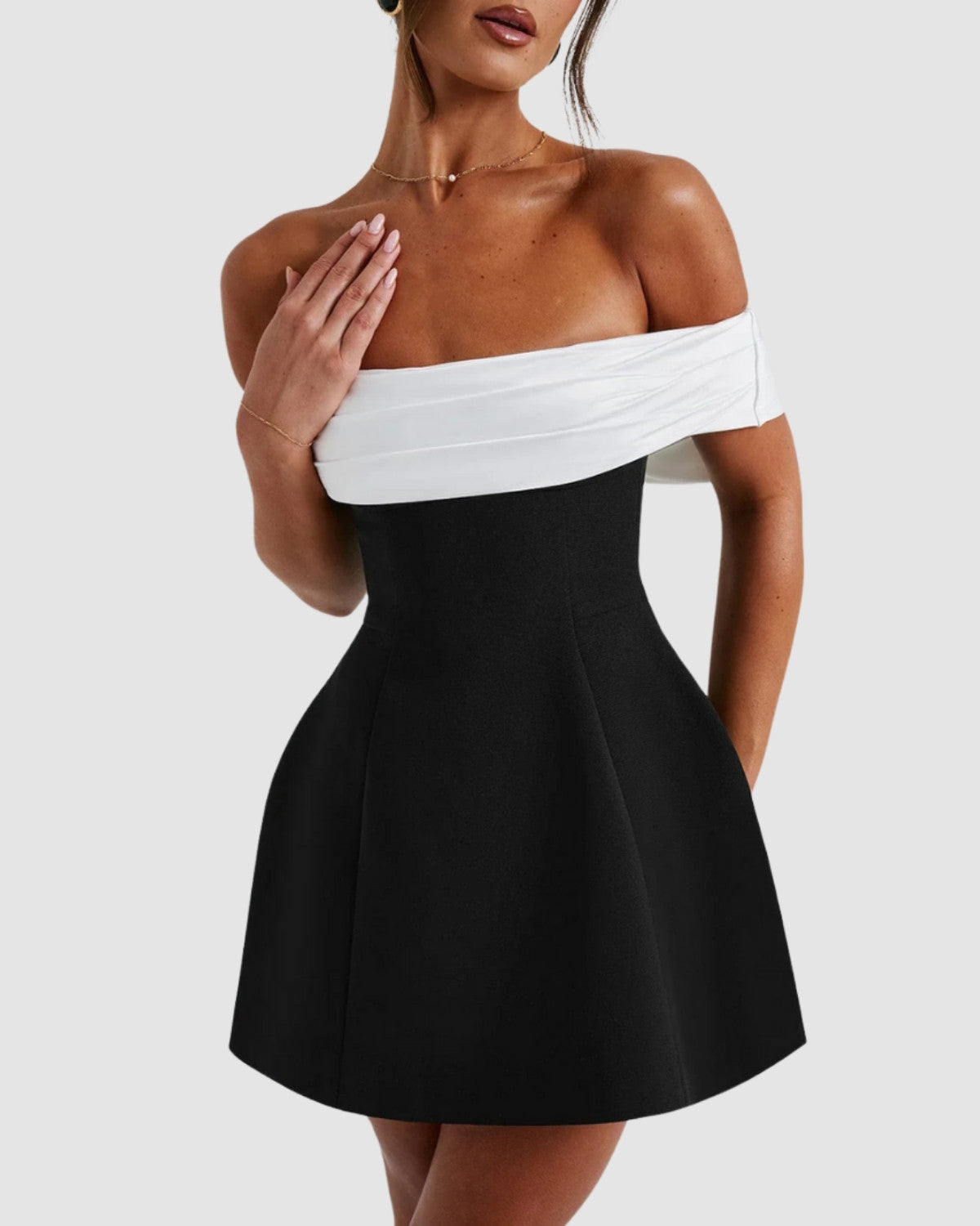 Isadora London Bow-Back Mini Dress – close-up of Bardot neckline with elegant black & white contrast.