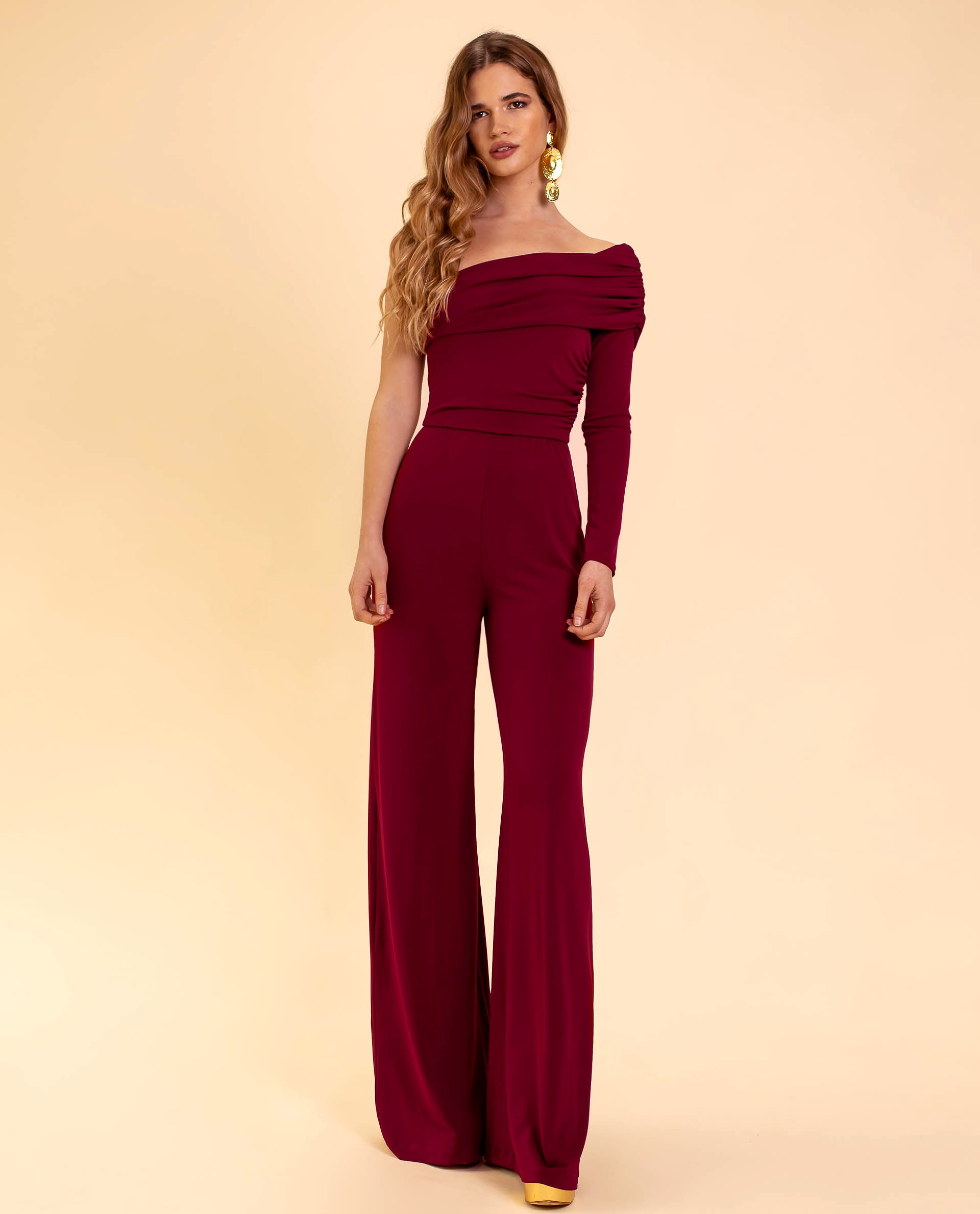 Woman in elegant off-shoulder burgundy jumpsuit – stylish, flattering and perfect for evening events – Isadora London