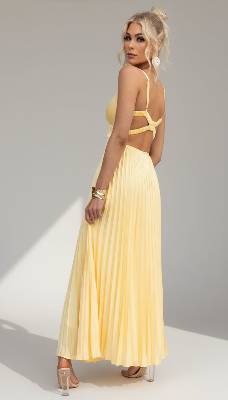 Model wearing the Isadora™ Yellow V-Neck Maxi Dress – elegant pleated summer dress with a flattering wrap neckline and flowy silhouette, perfect for weddings, garden parties, and sunny days.
