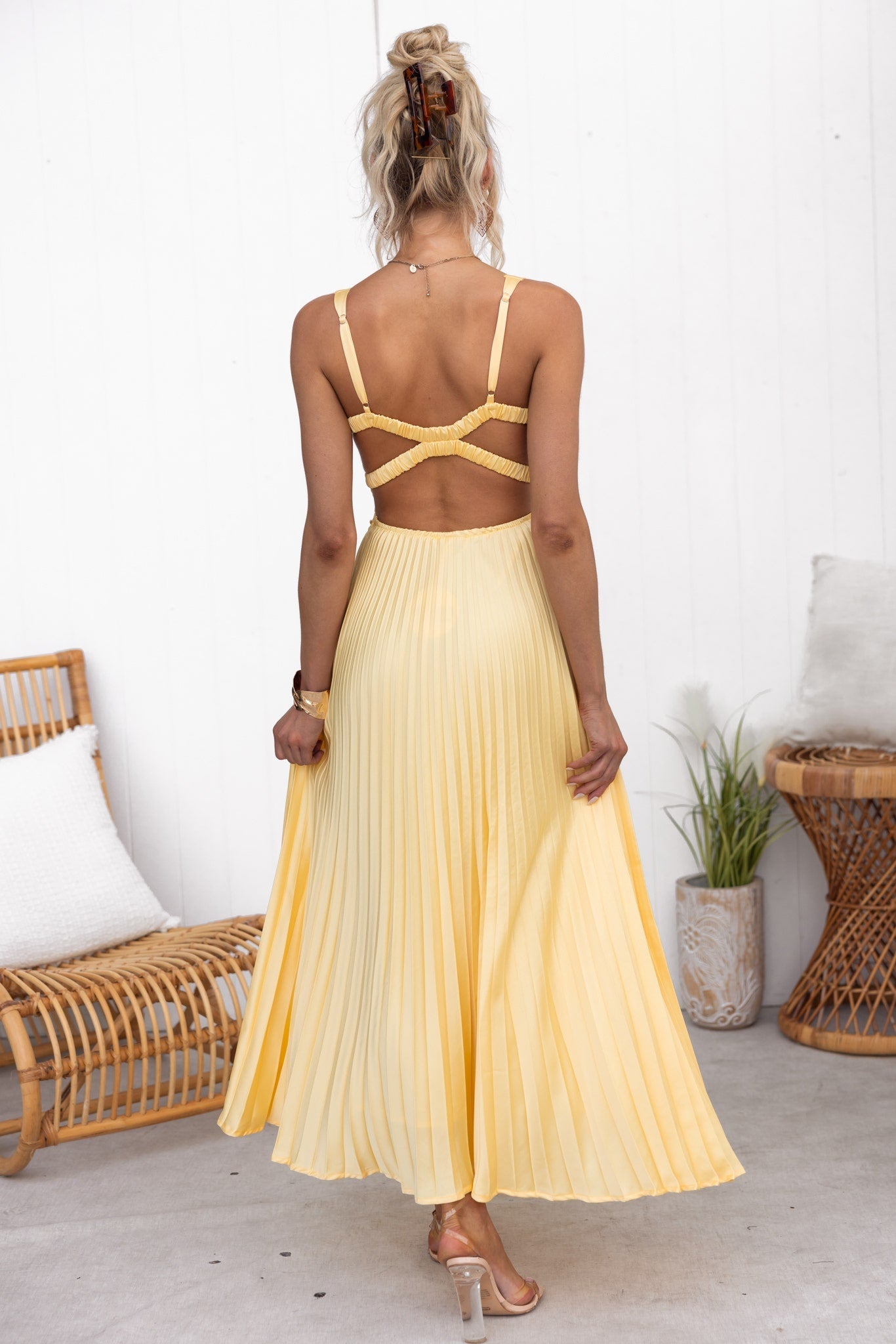 Model wearing the Isadora™ Yellow V-Neck Maxi Dress – elegant pleated summer dress with a flattering wrap neckline and flowy silhouette, perfect for weddings, garden parties, and sunny days.