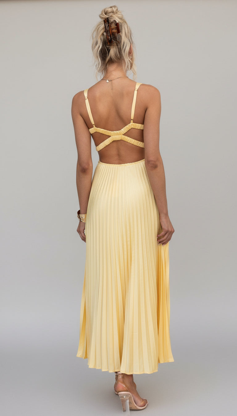 Model wearing the Isadora™ Yellow V-Neck Maxi Dress – elegant pleated summer dress with a flattering wrap neckline and flowy silhouette, perfect for weddings, garden parties, and sunny days.