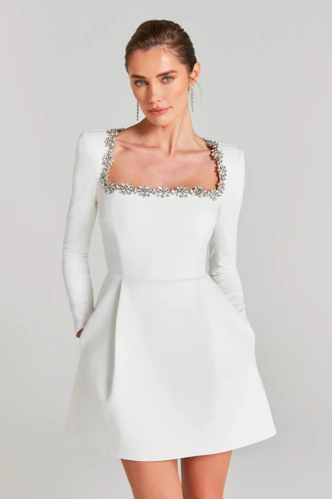 White velvet long sleeve mini dress – embellished square neckline; Isadora London.