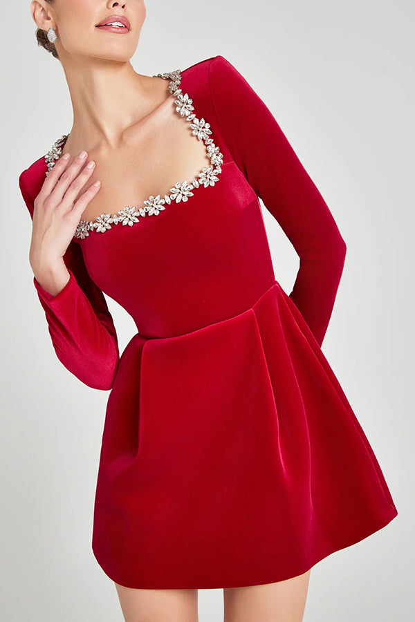 Red velvet mini – long sleeves, square neck with floral trim; Isadora London.