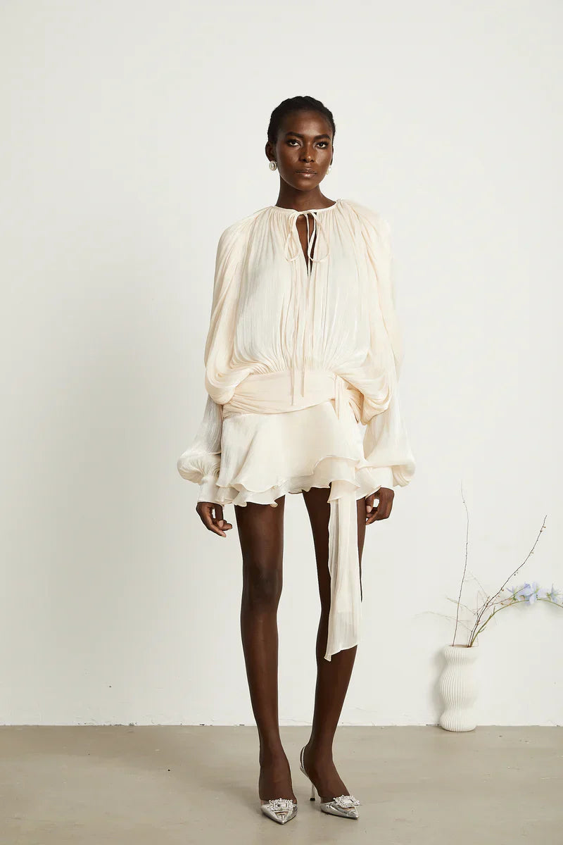 Front view of apricot Luxe Flowy Mini Dress Isadora London – lightweight and chic.