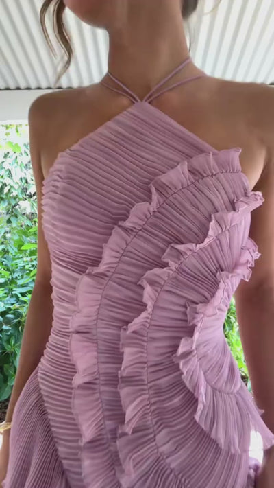 Delightful Ruffled Dress by Isadora London – pink halter-neck dress with pleated fabric, statement ruffle detailing and an elegant feminine silhouette.