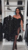 Sequin Romper Dress – holiday party video. Model showcasing black sequin romper, perfect for Christmas, New Year’s Eve and festive nights by Isadora London.